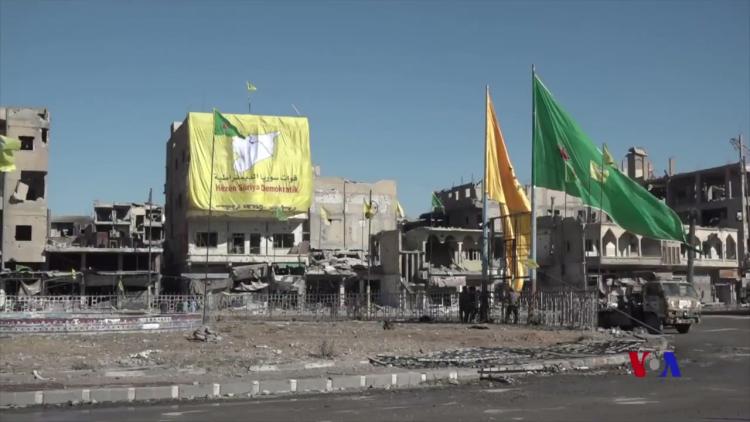 sdf ypg and ypj flags in raqqa centre