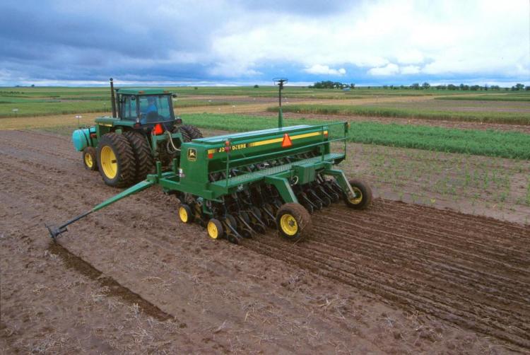 farmer and tractor planting